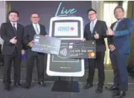  ??  ?? From left: Visa Malaysia country head Ng Kong Boon, Nazri, RHB Banking head of group cards and unsecured business Sien Vee Loc and MasterCard Malaysia country head Perry Ong during the launch yesterday.