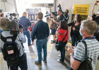  ?? FRANK GUNN
THE CANADIAN PRESS ?? Premier Doug Ford loads a truck at the opening of a new Daily Bread Food Bank in Toronto on Monday. Ford has said that mass testing is the province’s best defence against COVID-19.