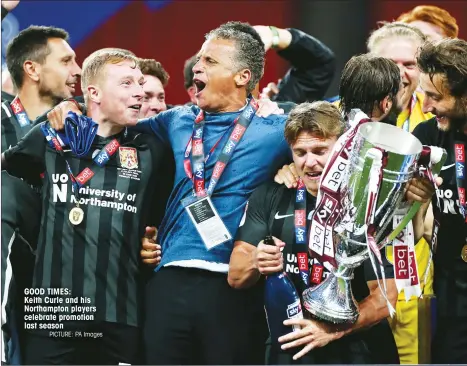  ?? PICTURE: PA Images ?? GOOD TIMES:
Keith Curle and his Northampto­n players celebrate promotion last season