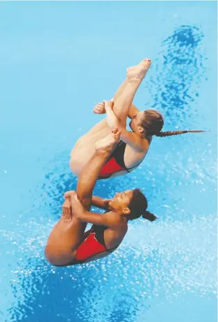  ?? TOM PENNINGTON/GETTY IMAGES ?? Jennifer Abel and Melissa Citrini-beaulieu of Team Canada knew they had clinched silver with their final dive Sunday. “It was an emotional moment, a relief,” Abel says.