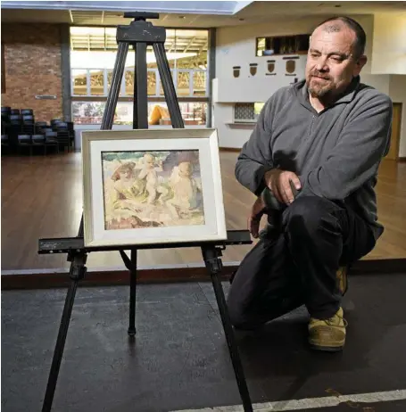  ?? PHOTO: NEV MADSEN ?? RARE FIND: Downlands Art Show curator Evan Hollis with a rare Arthur Murch painting unearthed from a private collection ahead of this year’s Downlands Art Exhibition.