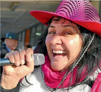  ?? JOHN HAWKINS/STUFF ?? Margaret Amor of Queenstown takes part in the Freeze Ya Bits Off Busking competitio­n on Gore’s main street yesterday.