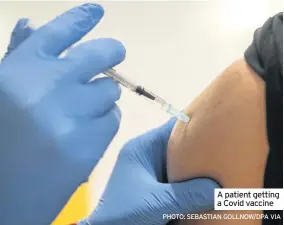  ?? Photo: SebaStian Gollnow/dPa via ?? a patient getting a Covid vaccine
