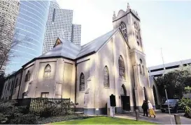  ?? Gary Coronado / Houston Chronicle ?? Antioch Missionary Baptist Church, which moved to its present Clay Street location in 1879, today is surrounded by skyscraper­s.