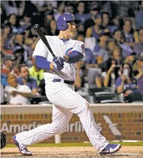  ?? CHARLES REX ARBOGAST/THE ASSOCIATED PRESS ?? The Cubs’ Anthony Rizzo watches his home run Tuesday against the Reds in Chicago. The Cubs returned to .500, beating the Reds 9-5.