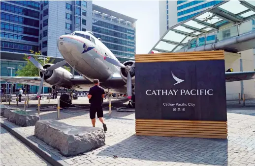  ?? AP ?? Cathay Pacific Airways’ shares have lost almost half their value since the start of the year , with passenger numbers unlikely to recover before 2024.