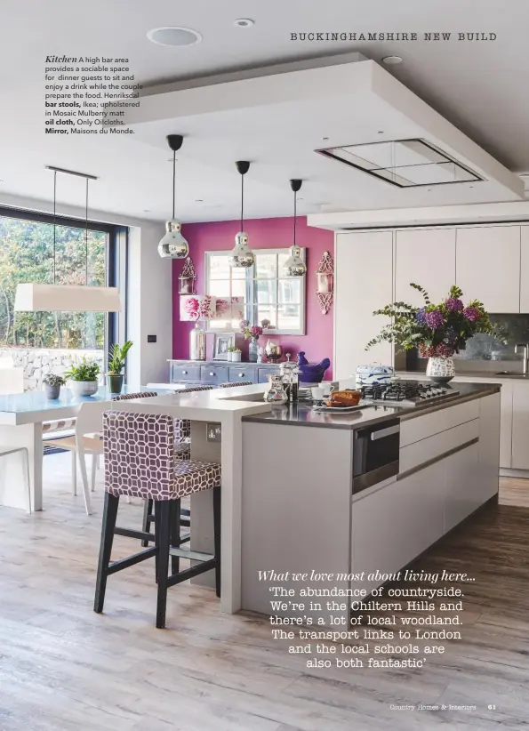  ??  ?? Kitchen A high bar area provides a sociable space for dinner guests to sit and enjoy a drink while the couple prepare the food. Henriksdal­bar stools, Ikea; upholstere­d in Mosaic Mulberry mattoil cloth, Only Oilcloths.Mirror, Maisons du Monde.