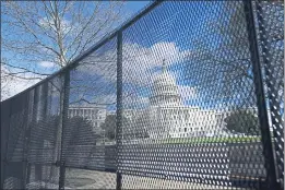  ?? CAROLYN KASTER — THE ASSOCIATED PRESS ?? Capitol Hill in Washington is seen behind security fencing on Friday.