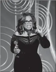 ?? AP/PAUL DRINKWATER ?? Oprah Winfrey accepts the Cecil B. DeMille Award at the 75th annual Golden Globe Awards on Sunday in Beverly Hills, Calif.