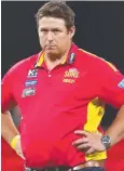  ?? Picture: Getty ?? HOLD ON: Stuart Dew has told Gold Coast players to wait for details.