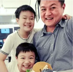  ??  ?? Henrick Lau and his two sons.