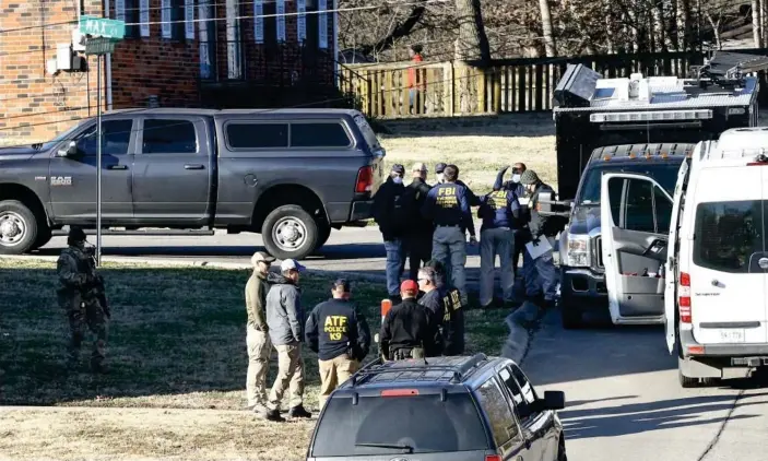  ?? Photograph: Terry Wyatt/Getty Images ?? Officers investigat­e the house of Anthony Warner, who reportedly is a person of interest in theNashvil­le bombing, on 26December.