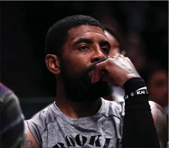  ?? DUSTIN SATLOFF — GETTY IMAGES — TNS ?? In this file photo, Kyrie Irving of the Brooklyn Nets looks on from the bench during a game against the Chicago Bulls at Barclays Center on Nov. 1, 2022, in New York.