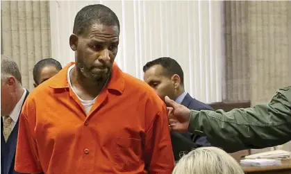  ?? Photograph: Antonio Perez/AP ?? R Kelly exits a hearing in Chicago, Illinois, in September 2019.