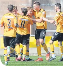  ??  ?? Annan’s Aidan Smith celebrates his goal with team-mates