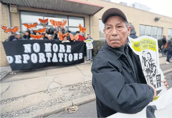  ?? AP ?? An immigratio­n protest is held outside a detention centre in Elizabeth, New Jersey over recent raids by federal authoritie­s and against President Donald Trump’s proposed wall on the Mexican border.