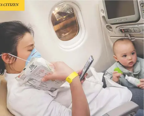  ?? MICHAEL SCHELLENBE­RG / THE CANADIAN PRESS ?? Summer Wu and her one-year-old son Felix wait on a plane at Wuhan airport, accompanie­d by Wu’s husband Michael Schellenbe­rg —
one of the dozens of families and other passengers who departed on a long-awaited evacuation flight early Friday back to Canada.