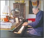  ??  ?? Peter Fuchs plays the piano at his home.