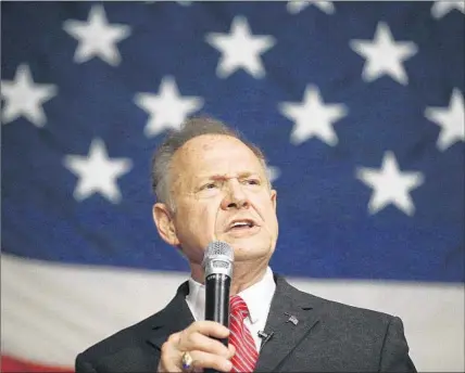  ?? Brynn Anderson Associated Press ?? REPUBLICAN Senate candidate Roy Moore, shown at an early December rally, is expected to win in the special election in Alabama on Tuesday. If he does, it will be because his party no longer pretends to object to racism and bigotry.