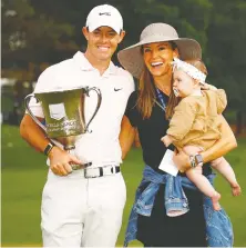  ?? JARED C. TILTON/GETTY IMAGES ?? Rory McIlroy celebrates with his wife Erica and daughter Poppy after his Wells Fargo win.