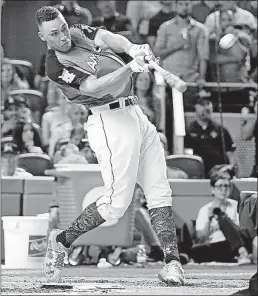  ?? [WILFREDO LEE/THE ASSOCIATED PRESS] ?? Aaron Judge of the Yankees launches a long ball in the Home Run Derby at Marlins Stadium. The rookie slugger’s longest homer went 513 feet en route to his victory.