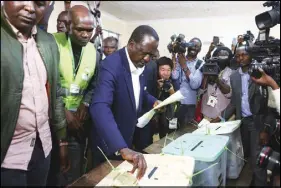  ?? AP PHOTO ?? Kenyan Opposition leader Raila Odinga, casts his vote in the Kibera slum in Nairobi yesterday.
