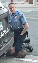 ??  ?? This still image taken from a video shows a Minneapoli­s officer kneeling on George Floyd on Monday. — AFP