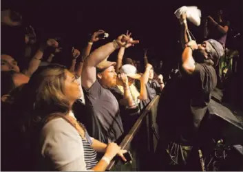  ?? Photograph­s by Francine Orr Los Angeles Times ?? KILLER MIKE gets up close and personal with his fans during a raw, urgent performanc­e at the Echoplex.