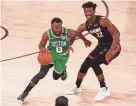  ?? KIM KLEMENT/USA TODAY SPORTS ?? Celtics guard Kemba Walker (8) drives against Heat forward Jimmy Butler (22) during the second half of Game 3 of the Eastern Conference Finals on Saturday.