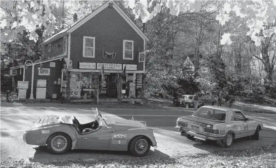  ?? DANNY G. TAYLOR ?? Cars participat­e in the Great American Mountain Rally Revival, now run in October in New England. Few owners of vintage vehicles are willing to expose them to the bad weather.