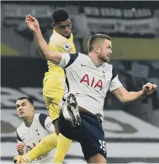  ??  ?? Fulham’s Ivan Cavaleiro out jumps Eric Dier to score the equalising goal.