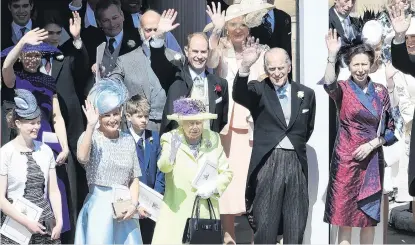  ?? PHOTO: GETTY IMAGES ?? Queen Elizabeth II and Prince Philip, Duke of Edinburgh and other members of the royal family wave as Prince Harry and Meghan Markle leave St George’s Chapel in Windsor Castle.