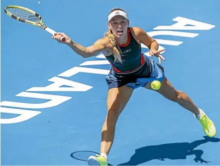  ??  ?? Caroline Wozniacki stretches to play a forehand return during her first round match against Laura Siegemund at the ASB Classic in Auckland yesterday. GETTY IMAGES