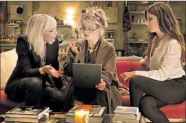  ?? Barry Wetcher Warner Bros. ?? CATE BLANCHETT, left, Helena Bonham Carter and Sandra Bullock in “Ocean’s 8.” Bonham Carter insisted on playing an Irish character in the film.