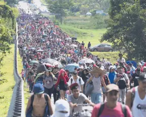  ?? MARCO UGARTE/AP ?? Hundreds of migrants arrive Oct. 27 in Villa Comaltitla­n in southern Mexico’s Chiapas state as they continue their journey north to the U.S. border.