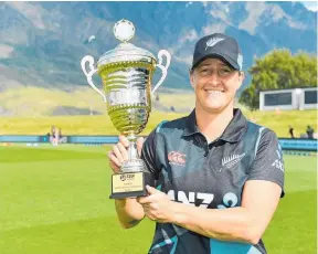  ?? Photo / Photosport ?? White Ferns captain Sophie Devine with the spoils of victory at John Davies Oval in Queenstown.