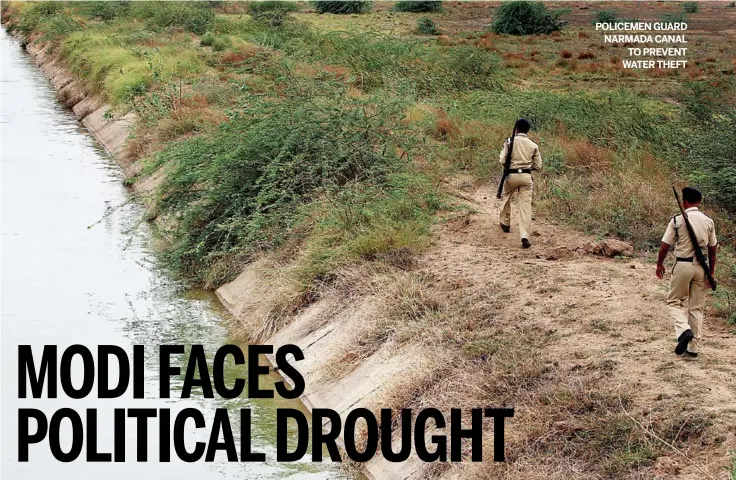  ?? SHAILESH RAVAL/ www. indiatoday­images. com ?? POLICEMEN GUARD NARMADACAN­AL TO PREVENT WATER THEFT