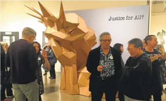 ?? SAL PIZARRO/STAFF ?? “Liberty Weeps,” a piece by Joseph DeLappe with Charlie Becker, is the centerpiec­e of “Justice For All?,” an art exhibition at the Euphrat Museum of Art at De Anza College, which had its opening reception on Wednesday.