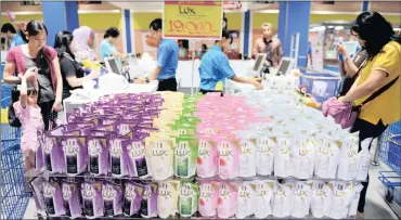  ?? PHOTO: BLOOMBERG ?? Packets of Unilever’s Lux liquid body soap sit on display at a Hypermart supermarke­t in Karawaci, Banten, Indonesia. Unilever reported quarterly sales growth that beat estimates and affirmed its outlook for the year.