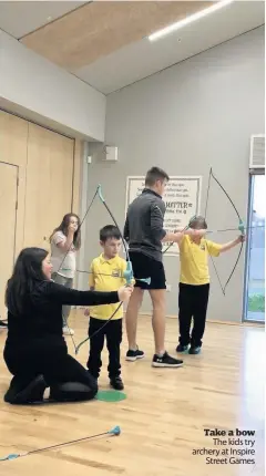  ??  ?? Take a bow The kids try archery at Inspire Street Games