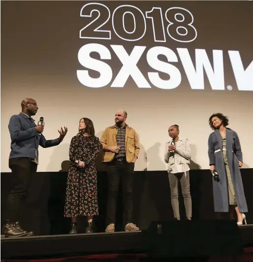  ?? Sarah Kerver / Getty Images ?? Director Barry Jenkins talks to “Fast Color” director Julia Hart, writer Jordan Horowitz and stars Saniyya Sidney and Gugu Mbatha-Raw at the movie’s premiere at SXSW at Paramount Theatre in Austin.