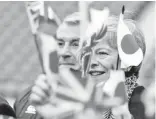  ?? - AFP photo ?? Jason Leonard (L) pictured at a school rugby event with Britain’s Prime Minister Theresa May.