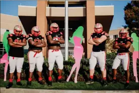  ??  ?? The Rome High football team joined the fight against breast cancer by taking up donations for mammogram screenings at The Breast Center at Floyd. Shown at Floyd Medical Center are Rome players Jorden Neal (from left), Stephano Green, Quantaviou­s Leslie, Aidan Gaines and Nick Burge.