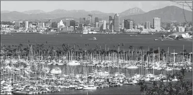  ?? San Diego Tourism ?? The skyline of San Diego forms a fitting backdrop for the sailboats that fill the bay.