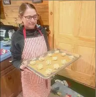  ?? ?? After Steve Wojcik received a life-saving heart transplant, he and his wife, Melissa, started up an at an-home bakery focused on raising awareness for organ donations. Here Melissa is shown baking in their home.