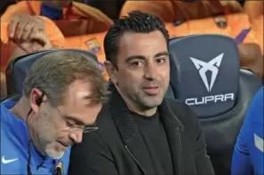  ?? (AFP) ?? Barcelona’s Spanish coach Xavi (right) during the Spanish League match between FC Barcelona and RC Celta de Vigo at the Camp Nou stadium in Barcelona on May 10, 2022.