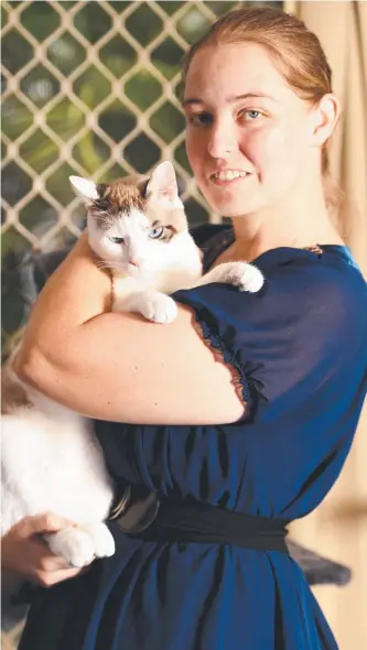  ?? Picture: ALIX SWEENEY ?? PEOPLE POWER: Emma Gregory, 29, with Aki, is organising a protest outside Townsville City Council against its decision regarding the RSPCA leaving Townsville.