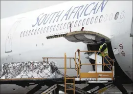  ?? KIM LUDBROOK/AP ?? The Johnson & Johnson COVID-19 vaccine is offloaded Saturday in Johannesbu­rg, South Africa. The vaccine was 85% effective at protecting against severe cases.