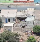  ?? PERUVIAN PRESIDENCY VIA EPA-EFE ?? The earthquake crumbled roads and destroyed homes in Arequipa, Peru. Hundreds of people were left homeless.