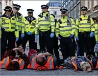  ?? ?? LYING DOWN: Eco protest in central London